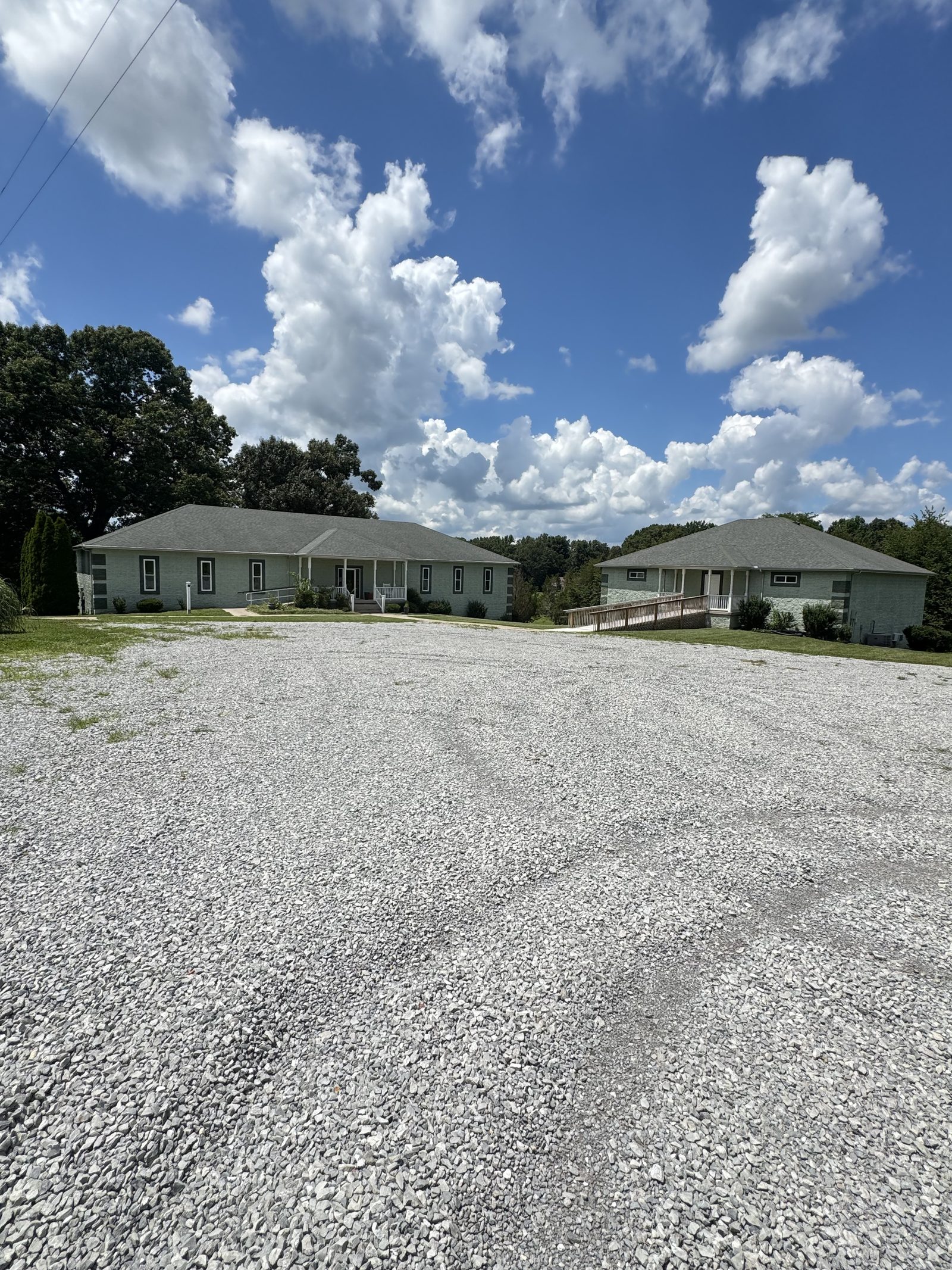 Residential buildings on the Wellness Ranch Kentucky campus under a bright Kentucky sky